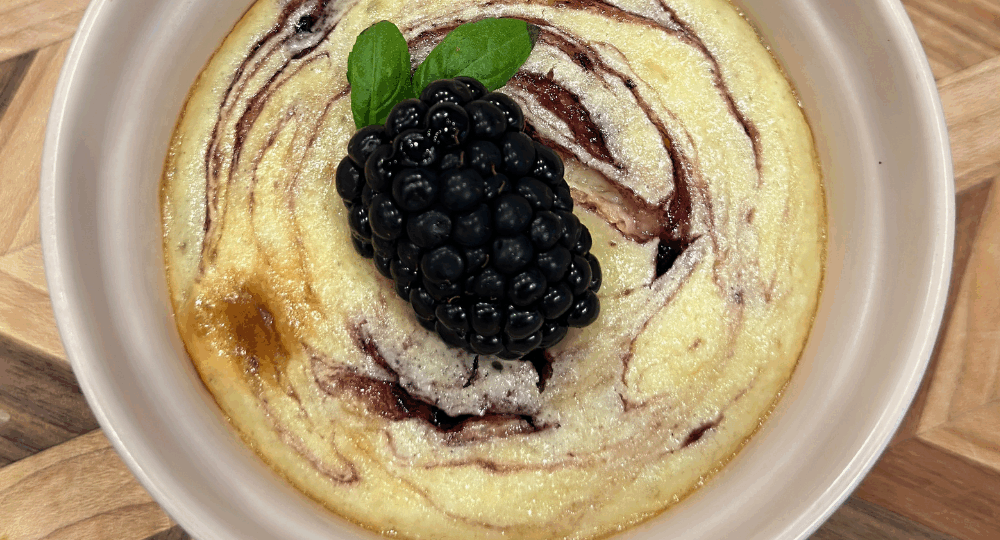 mini blackberry cheesecake in a ramekin