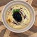 mini blackberry cheesecake in a ramekin